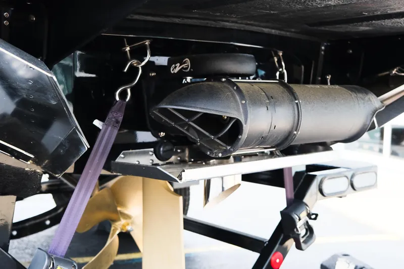 Slide: The Image of 2025 MasterCraft XT24 boat underside with propeller and exhaust system. - 10