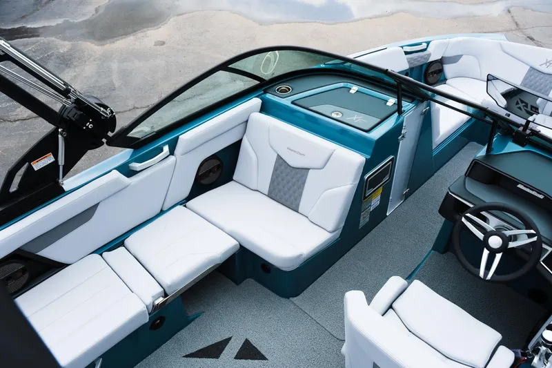 Slide: The Image of 2025 MasterCraft XT24 boat interior with modern seating and sleek design. - 20