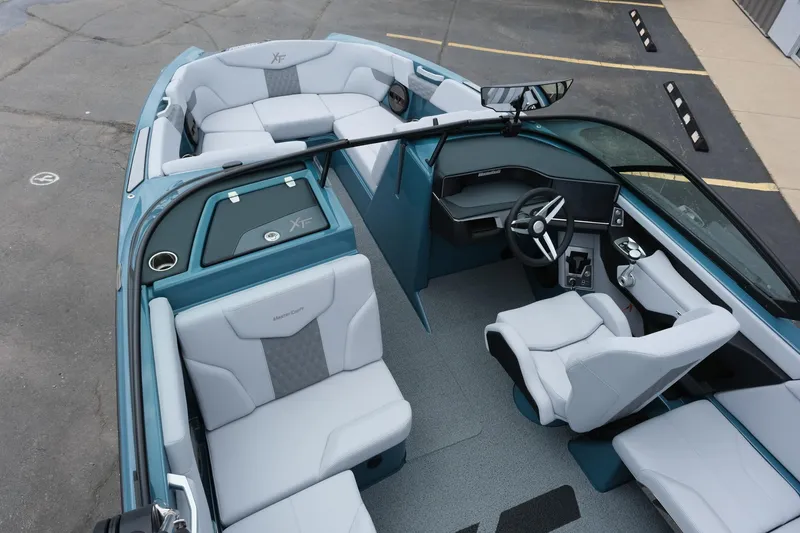 Slide: The Image of 2025 MasterCraft XT24 boat interior with modern seating and sleek design. - 22