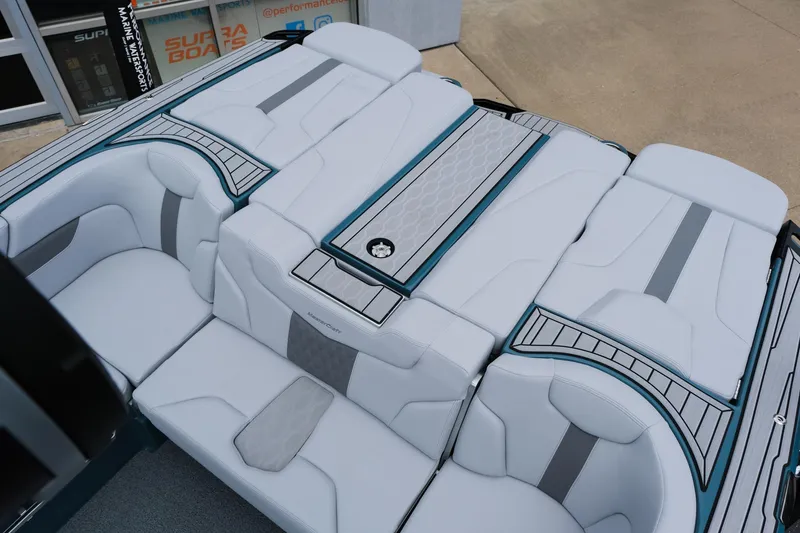 Slide: The Image of 2025 MasterCraft XT24 boat interior with sleek, modern seating design and stylish accents. - 23