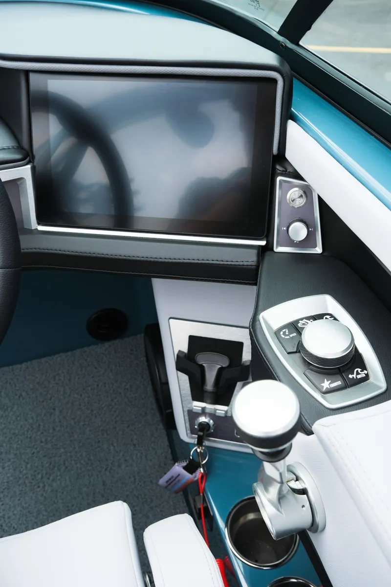 Slide: The Image of 2025 MasterCraft XT24 boat dashboard with touchscreen and control panel. - 27