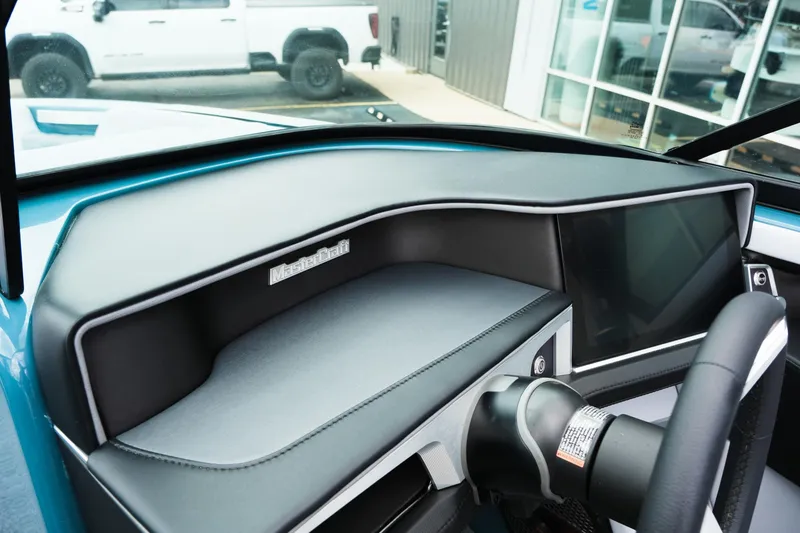 Slide: The Image of 2025 MasterCraft XT24 dashboard with sleek design and modern controls. - 30