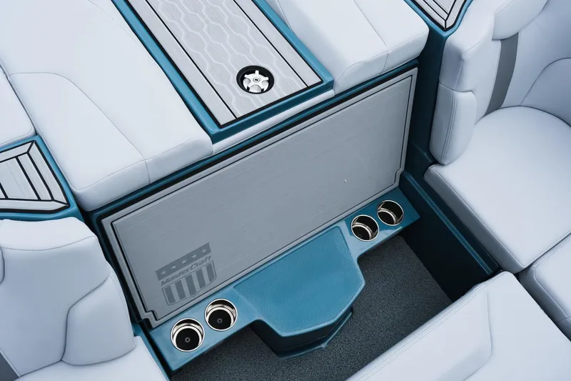 Slide: The Image of 2025 MasterCraft XT24 boat interior with sleek seating and cup holders. - 39