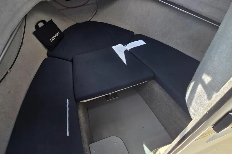 Slide: The Image of Interior cabin of a 2007 Trophy 2002 Walkaround boat with cushioned seating. - 10