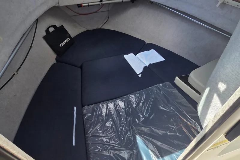 Slide: The Image of Interior cabin of a 2007 Trophy 2002 Walkaround boat with seating and storage. - 11