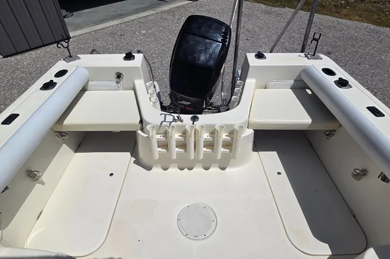 Slide: The Image of 2007 Trophy 2002 Walkaround boat interior with seating and motor. - 14