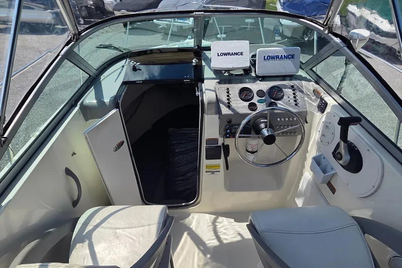 Slide: The Image of 2007 Trophy 2002 Walkaround boat interior with steering wheel and Lowrance navigation system. - 6