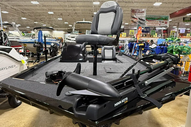 Slide: The Image of 2025 Lowe Legacy boat with Minn Kota trolling motor displayed in a showroom. - 3