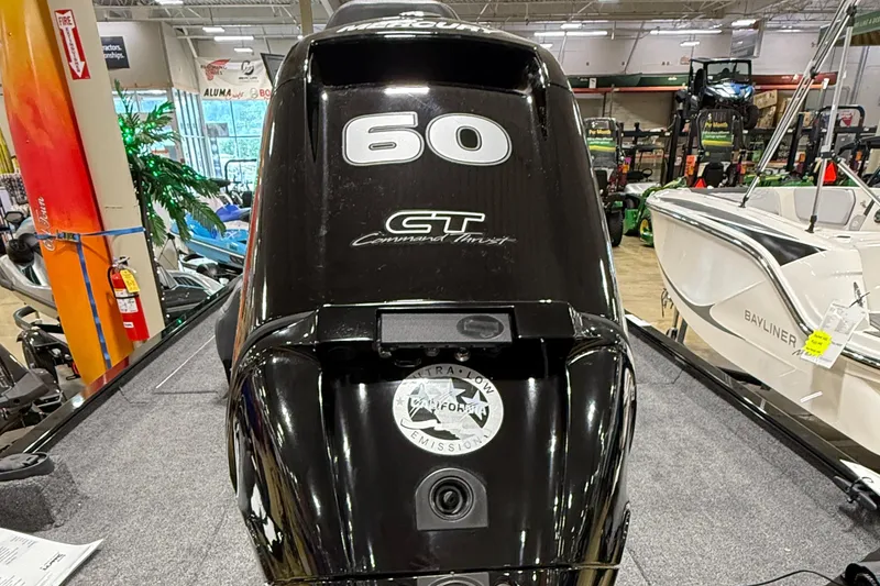 Slide: The Image of 2025 Lowe Legacy boat engine, 60 GT model, displayed in showroom. - 6