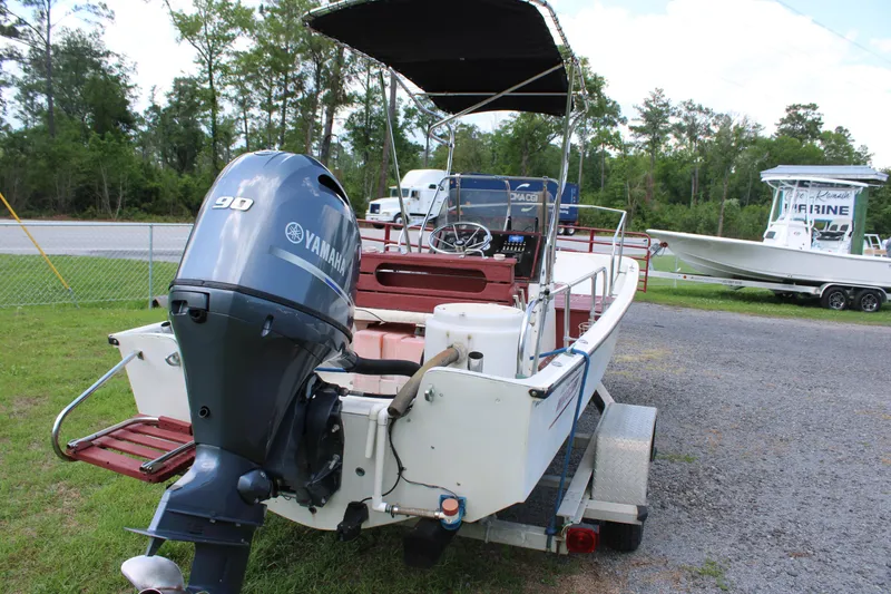 Slide: The Image of 1982 Boston Whaler 17 Montauk boat with Yamaha 90 outboard motor on trailer. - 7