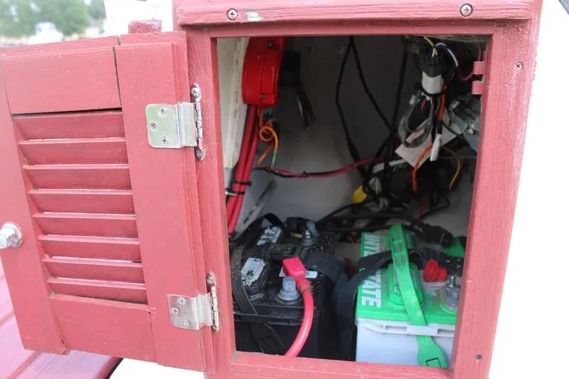 Slide: The Image of 1982 Boston Whaler 17 Montauk battery compartment with wiring and components. - 9