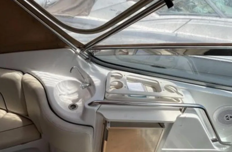 Slide: The Image of 2004 Chris-Craft 33 Express boat interior with sink and seating area. - 12