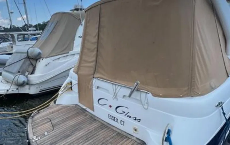 Slide: The Image of 2004 Chris-Craft 33 Express boat docked, covered, in Essex, CT marina. - 2