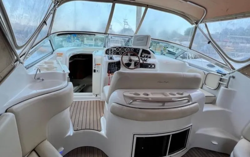 Slide: The Image of 2004 Chris-Craft 33 Express boat interior with helm, seating, and dashboard. - 20