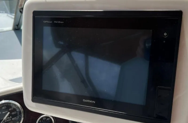Slide: The Image of Garmin GPSmap 7610xsv on 2004 Chris-Craft 33 Express dashboard. - 21