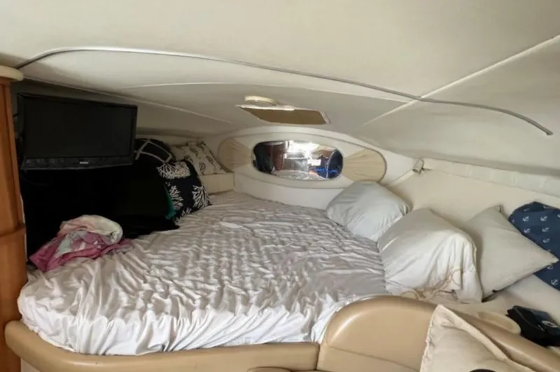 Slide: The Image of Interior cabin of 2004 Chris-Craft 33 Express with cozy bed and TV. - 39