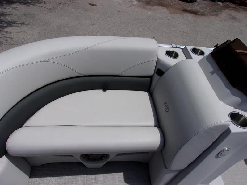 Slide: The Image of 2022 Avalon VLS Quad Lounger boat seat with cup holders and sleek design. - 13