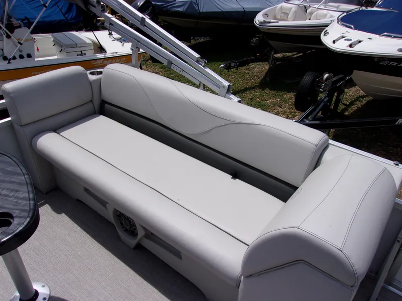 Slide: The Image of 2022 Avalon VLS Quad Lounger boat interior with sleek, comfortable seating. - 8