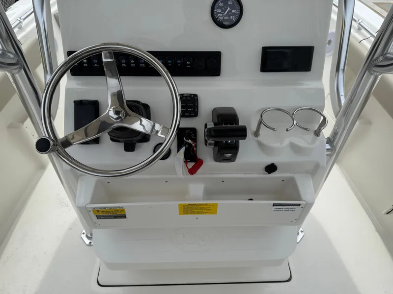 Slide: The Image of 2025 Key West 239 FS boat console with steering wheel and controls. - 10