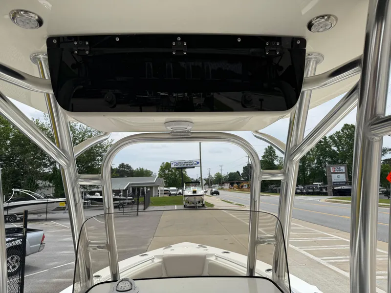 Slide: The Image of 2025 Key West 239 FS boat interior with T-top and street view. - 12