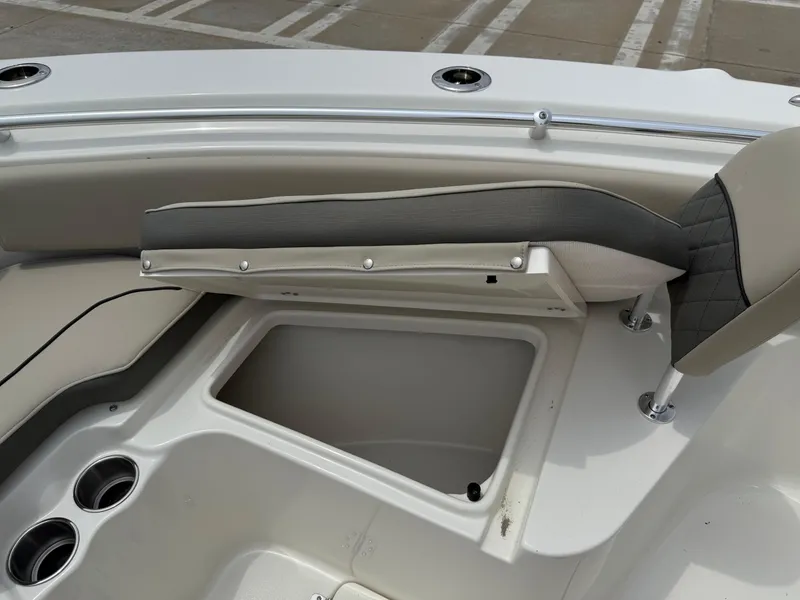 Slide: The Image of 2025 Key West 239 FS boat interior with open storage compartment and seating. - 17