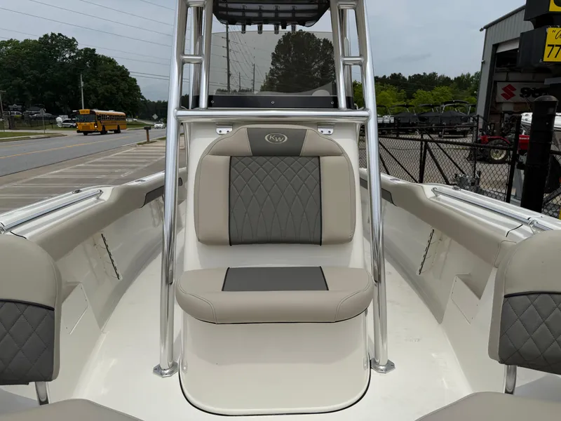 Slide: The Image of 2025 Key West 239 FS boat interior with cushioned seating and sleek design. - 18