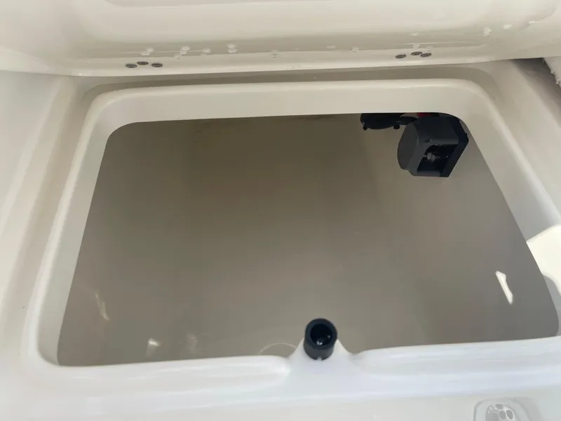 Slide: The Image of 2025 Key West 239 FS boat storage compartment, open and empty. - 23