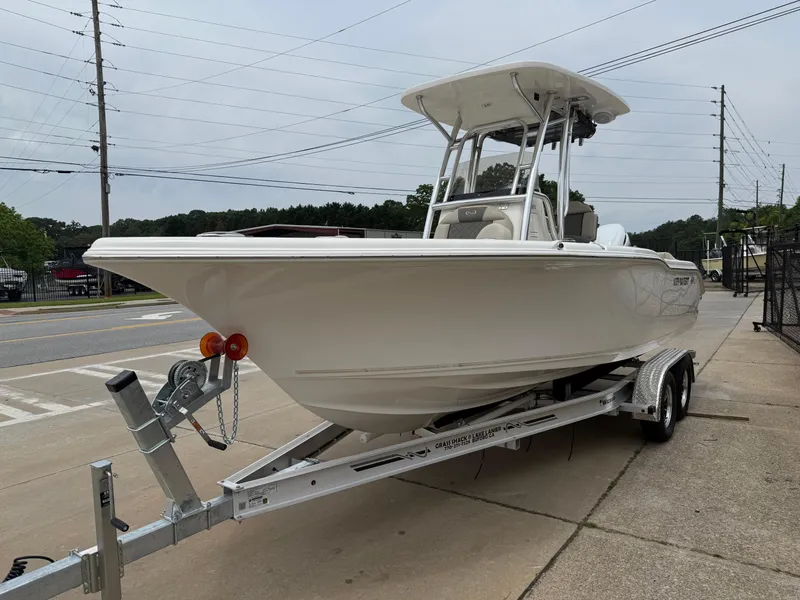 Slide: The Image of 2025 Key West 239 FS boat on trailer, parked outdoors, side view. - 3