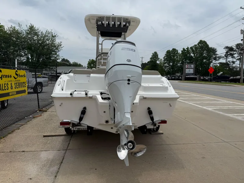 Slide: The Image of 2025 Key West 239 FS boat with outboard motor on a street. - 4