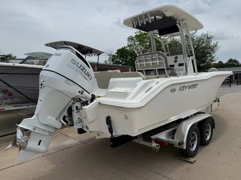 Slide: The Image of 2025 Key West 239 FS boat with Suzuki engine on a trailer. - 6