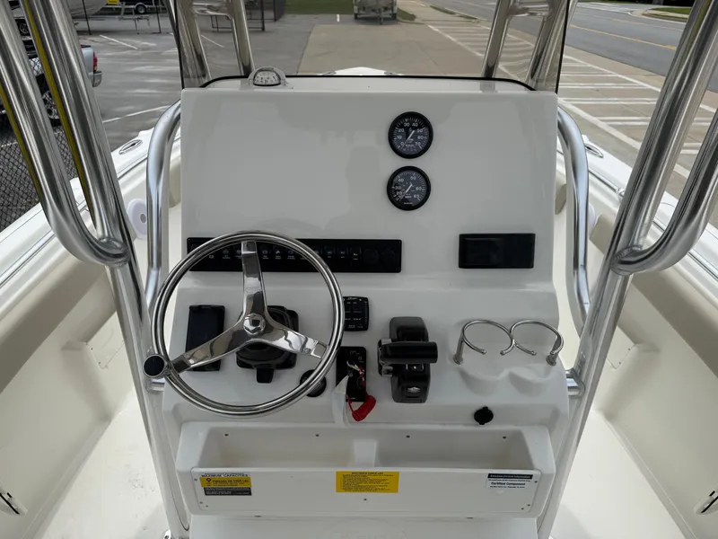 Slide: The Image of Center console of 2025 Key West 239 FS boat with steering wheel and gauges. - 9