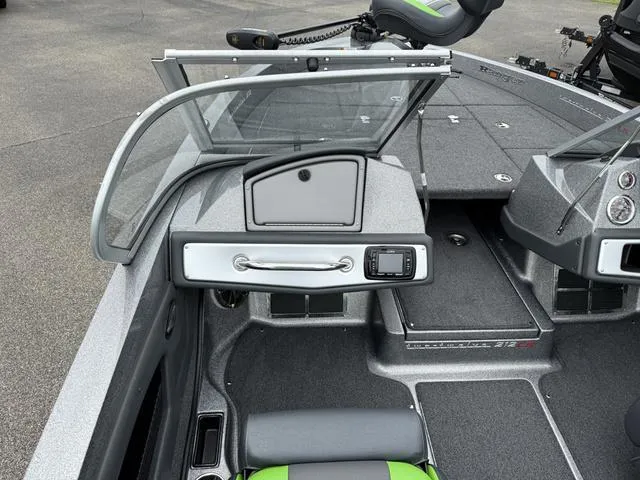 Slide: The Image of 2022 Ranger 212LS boat interior with open windshield and control panel. - 4