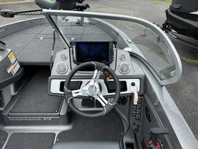 Slide: The Image of 2022 Ranger 212LS boat dashboard with steering wheel and Lowrance display. - 5