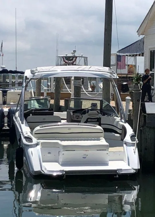 Slide: The Image of 2017 Cobalt R7 boat docked at a marina, featuring sleek design and spacious seating. - 3