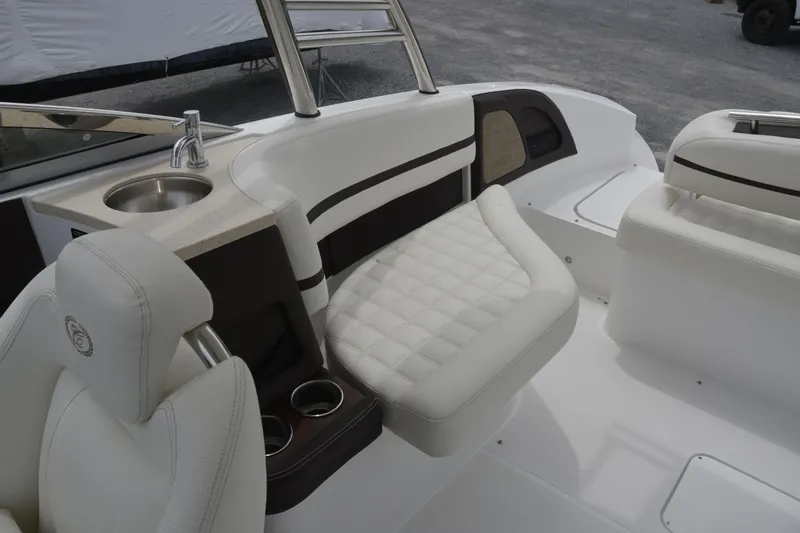 Slide: The Image of Luxurious interior of a 2017 Cobalt R7 boat with white seating and built-in sink. - 7