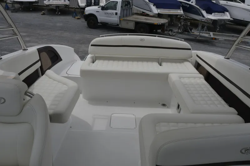 Slide: The Image of 2017 Cobalt R7 boat interior with white cushioned seating and sleek design. - 8