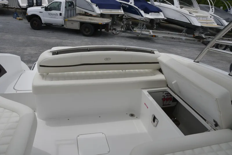 Slide: The Image of 2017 Cobalt R7 boat interior with white seating and storage compartment. - 9