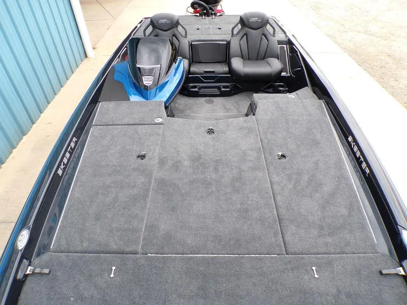 Slide: The Image of 2025 Skeeter ZXR21SE boat interior with spacious seating and carpeted deck. - 13