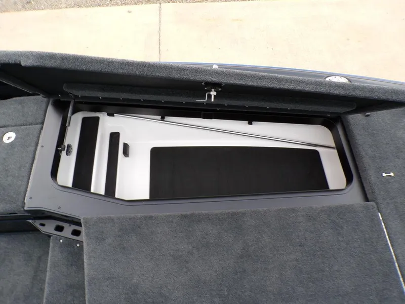 Slide: The Image of 2025 Skeeter ZXR21SE boat storage compartment with open lid, showcasing interior design. - 14