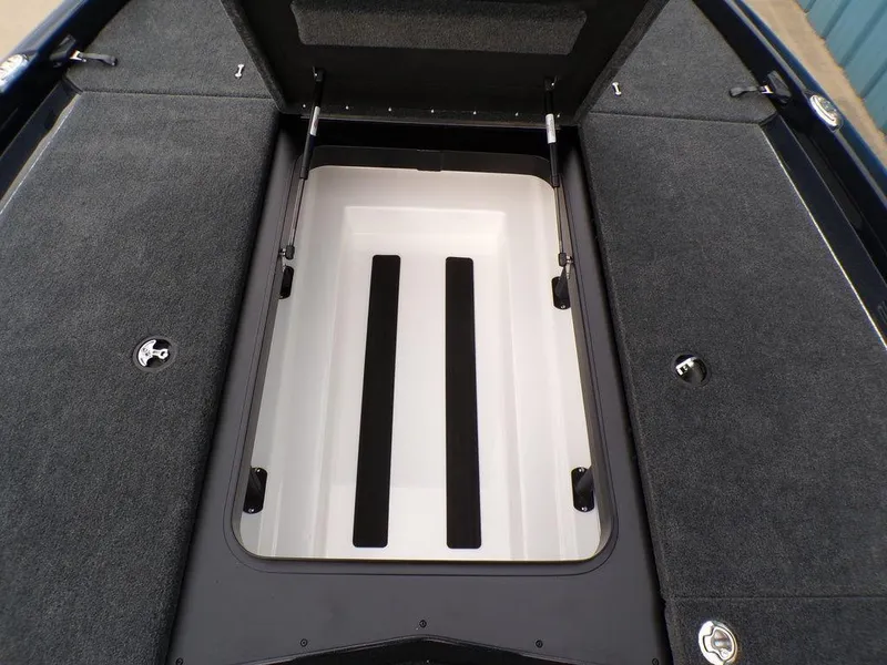 Slide: The Image of 2025 Skeeter ZXR21SE boat storage compartment with open lid, showcasing spacious interior design. - 15