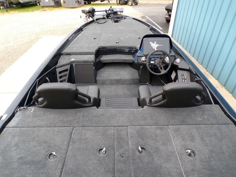 Slide: The Image of 2025 Skeeter ZXR21SE boat interior with dual seats and steering console. - 16
