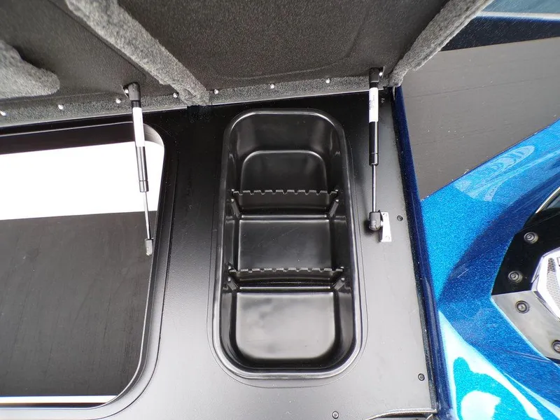 Slide: The Image of 2025 Skeeter ZXR21SE storage compartment with hydraulic lift, featuring a sleek black interior. - 19