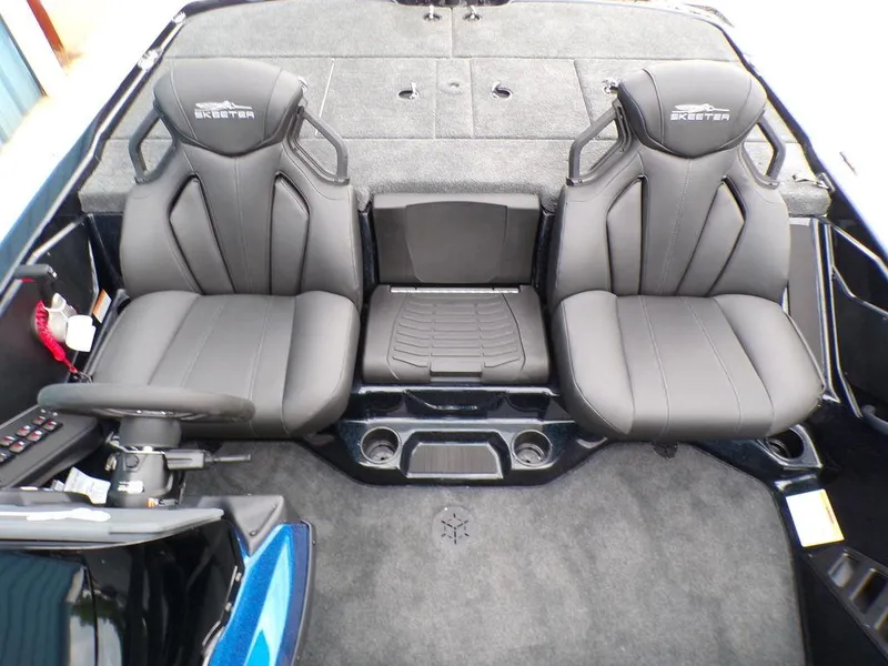 Slide: The Image of 2025 Skeeter ZXR21SE boat interior with dual black seats and center console. - 21