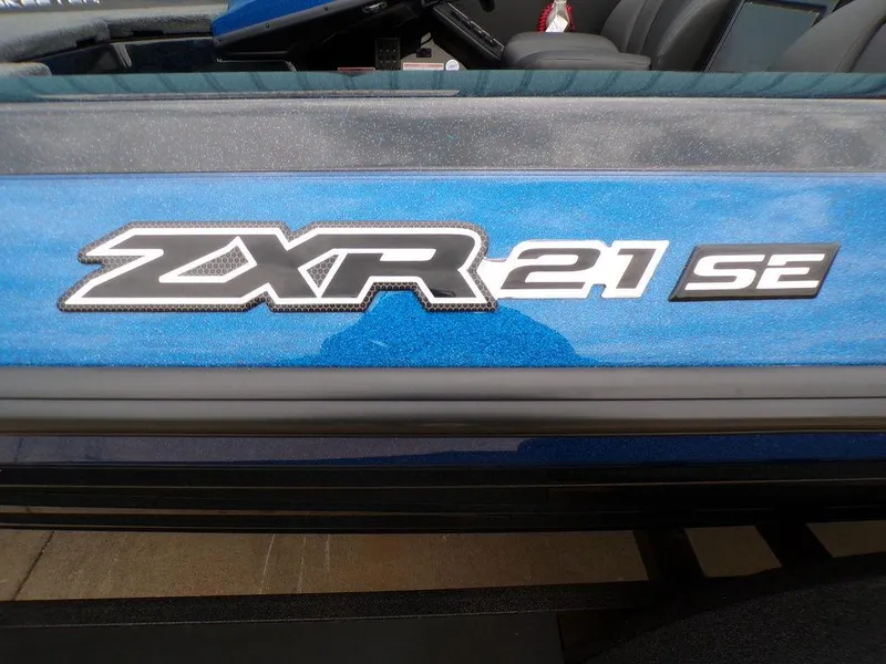 Slide: The Image of 2025 Skeeter ZXR21SE boat logo on blue exterior. - 8