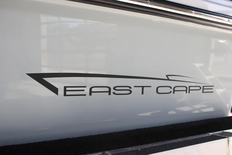 Slide: The Image of East Cape 25 Open 2025 model logo on boat exterior. - 11