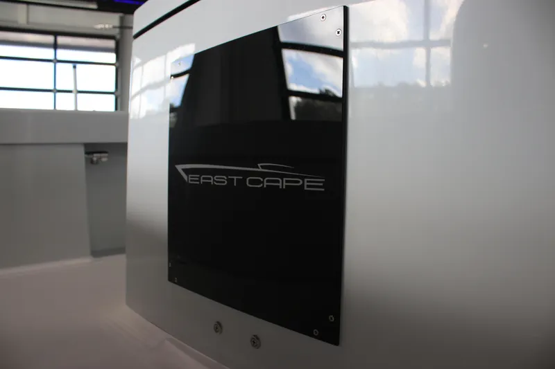 Slide: The Image of 2025 East Cape 25 Open boat interior with logo detail. - 15