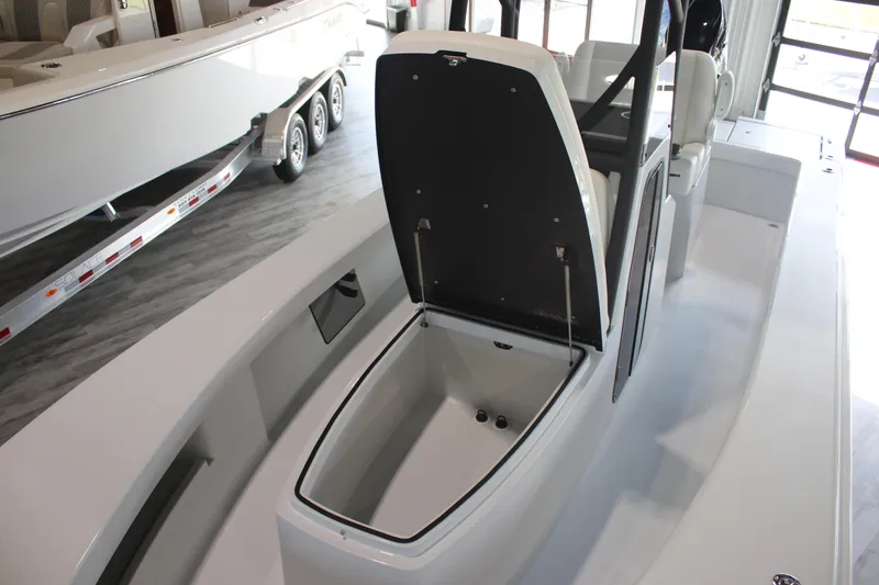 Slide: The Image of 2025 East Cape 25 Open boat interior with open storage compartment. - 18