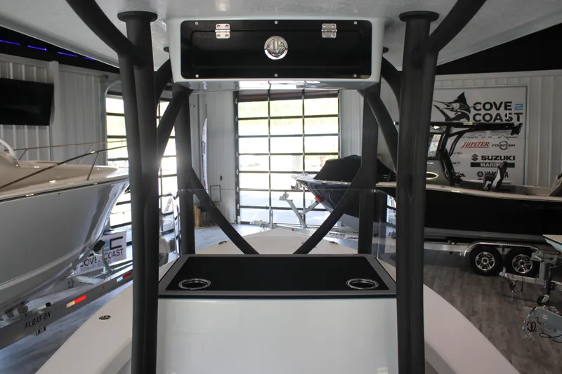 Slide: The Image of 2025 East Cape 25 Open boat interior in showroom with modern design features. - 24