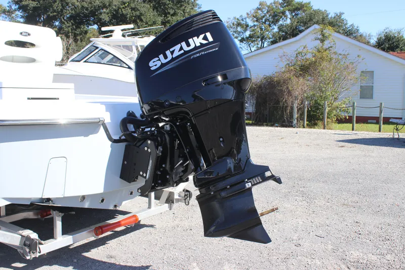 Slide: The Image of 2025 East Cape 25 Open boat with Suzuki outboard motor on a trailer. - 5