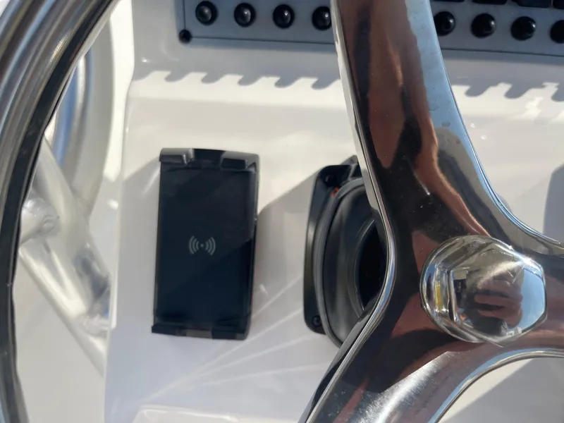 Slide: The Image of Steering wheel and control panel of 2025 Key West 239 FS boat. - 1